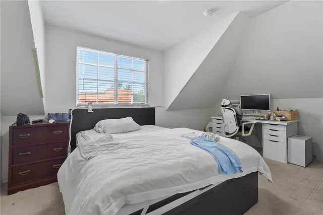 a bathroom with a sink mirror and a window