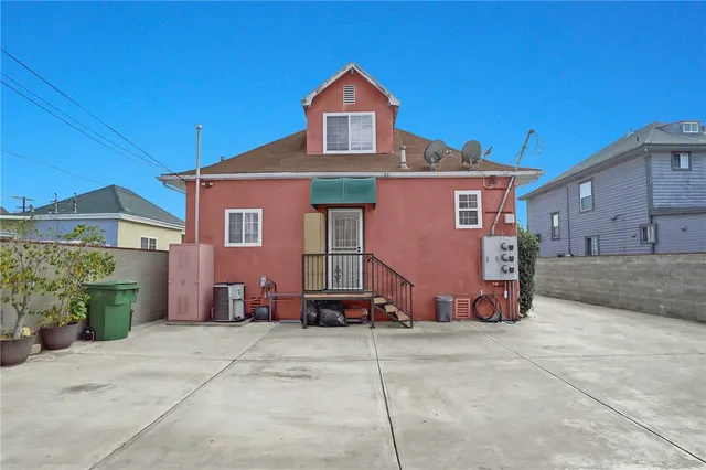 a front view of a building with many windows
