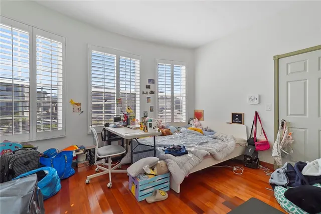 a bed room with a bed and a window