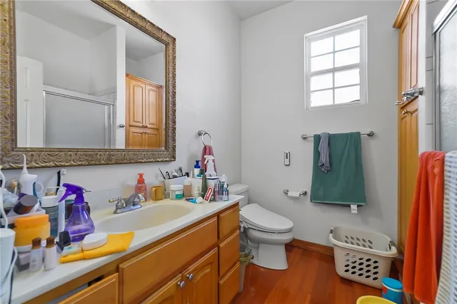 a bathroom with a toilet sink and mirror