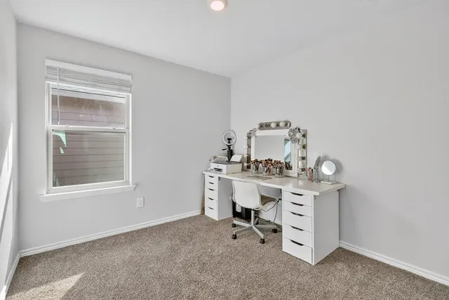 a view of a workspace with furniture