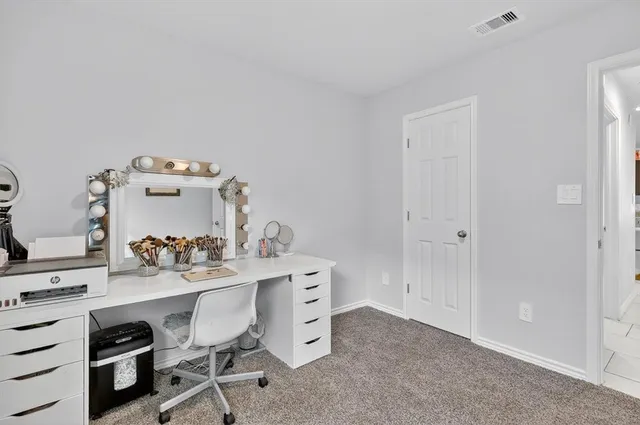 a view of a workspace with furniture