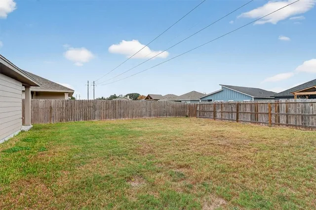 a view of an house with backyard and outdoor space