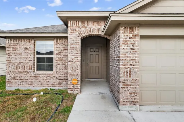 a front view of a house with a glass door