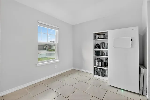 a view of a livingroom with shelves