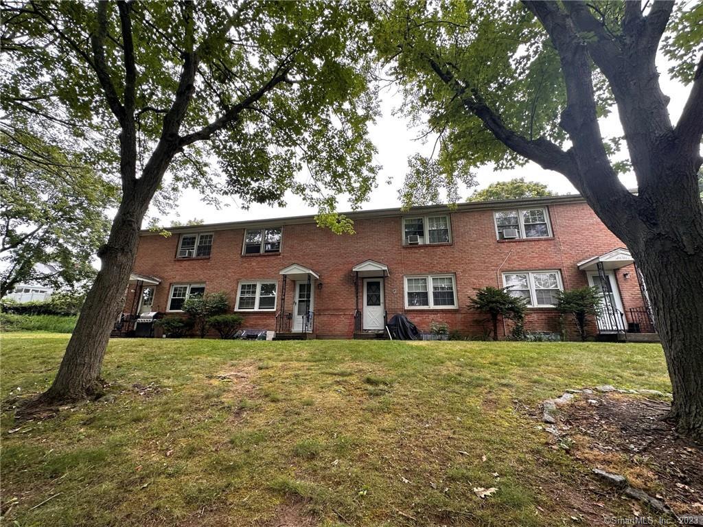 56 Huntington Road, Unit 3 New Haven, CT 06512 - Photo 1 of 1 a front view of house with yard and green space