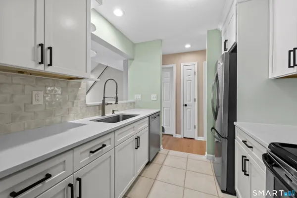 a view of an empty room with glass door