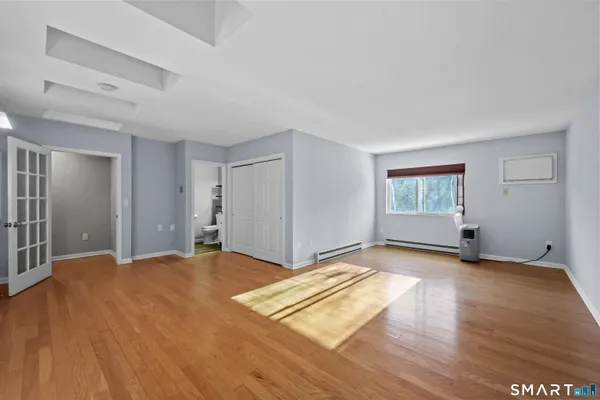 a view of a livingroom with wooden floor