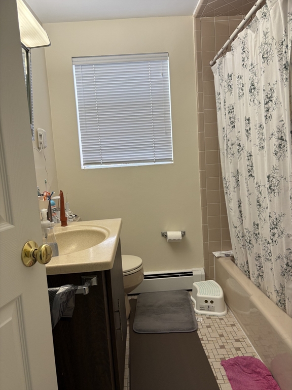 46 Rustic Street, Unit 46 Newton, MA 02458 - Photo 2 of 11 a bathroom with a sink toilet and shower