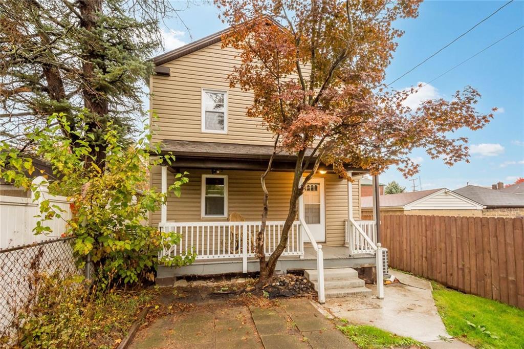 7129 Michigan Street Pittsburgh, PA 15218 - Photo 23 of 25 a front view of a house with a yard