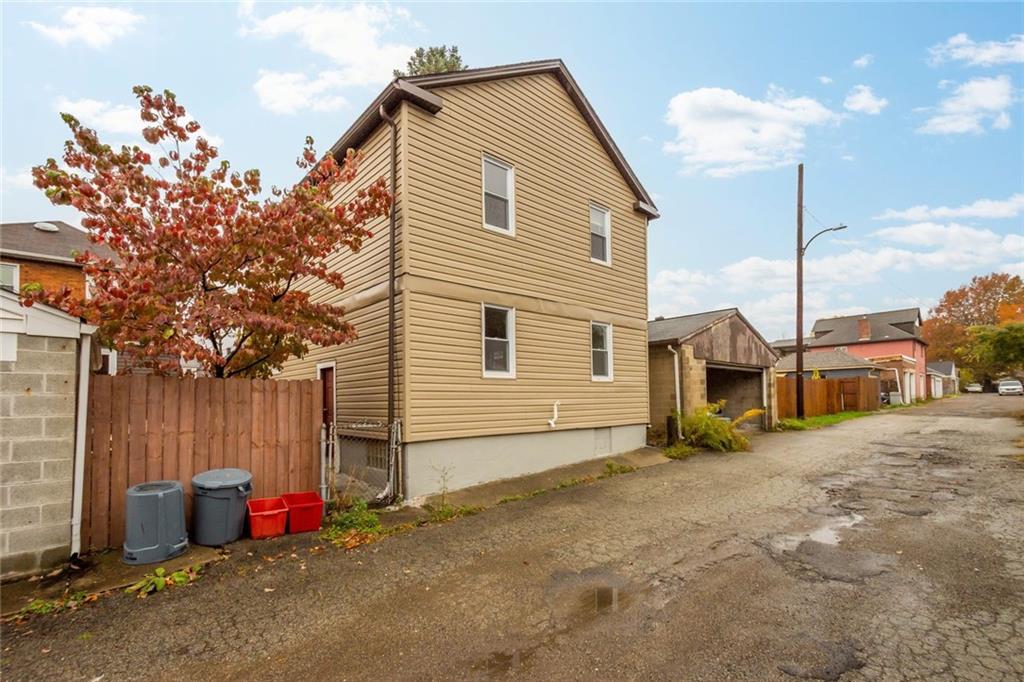 7129 Michigan Street Pittsburgh, PA 15218 - Photo 24 of 25 a view of a house with a yard