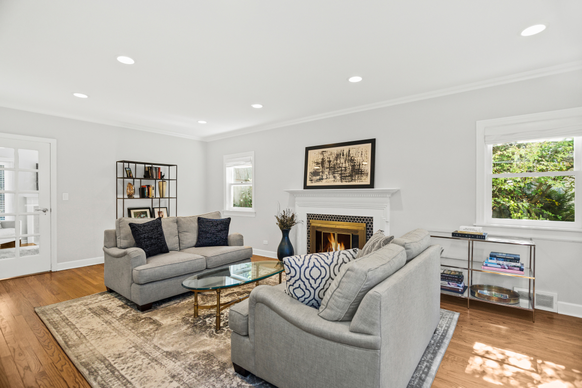 922 Cherokee Road Wilmette, IL 60091 - Photo 2 of 37 a living room with furniture and a fireplace