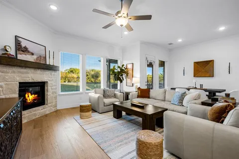a living room with furniture and a fireplace