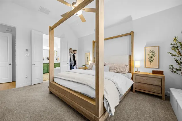 a bed room with a bed and a desk