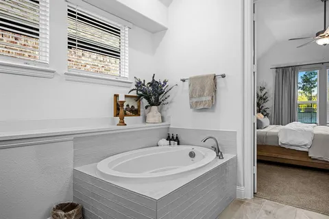 a bathroom with a sink double vanity sink and a bathtub
