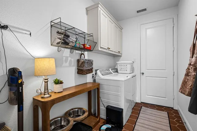 a bedroom with a bed and a computer on a desk
