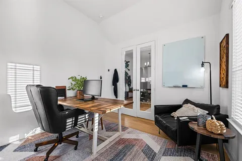 a view of a livingroom with furniture and lounge chair