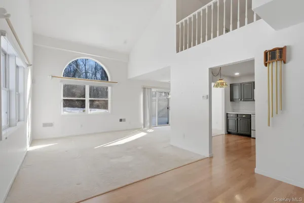 a view of an empty room with stairs