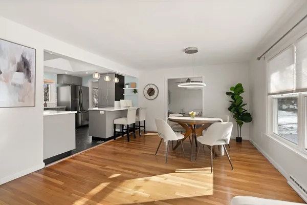 a dining room with furniture and window