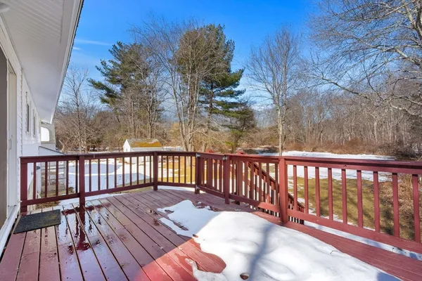 a view of balcony with wooden floor