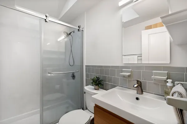 a view of a workspace with furniture and a potted plant