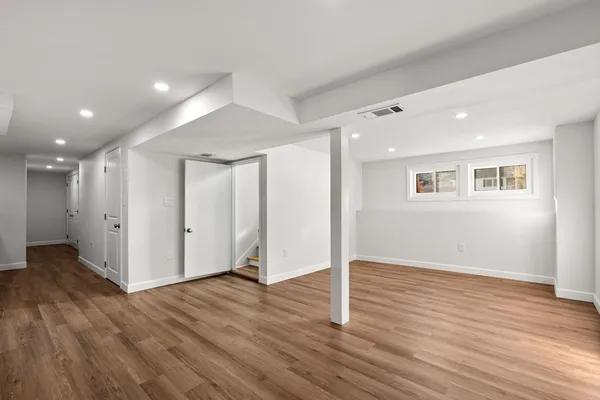 a bathroom with a toilet sink and shower