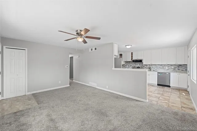 a view of a kitchen with a sink and a stove