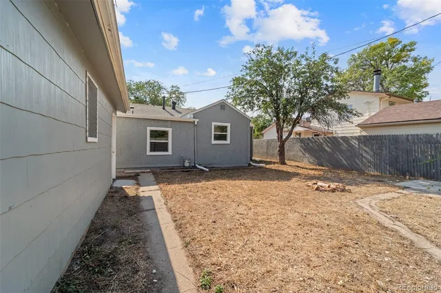 an aerial view of a house with yard porch and sitting area