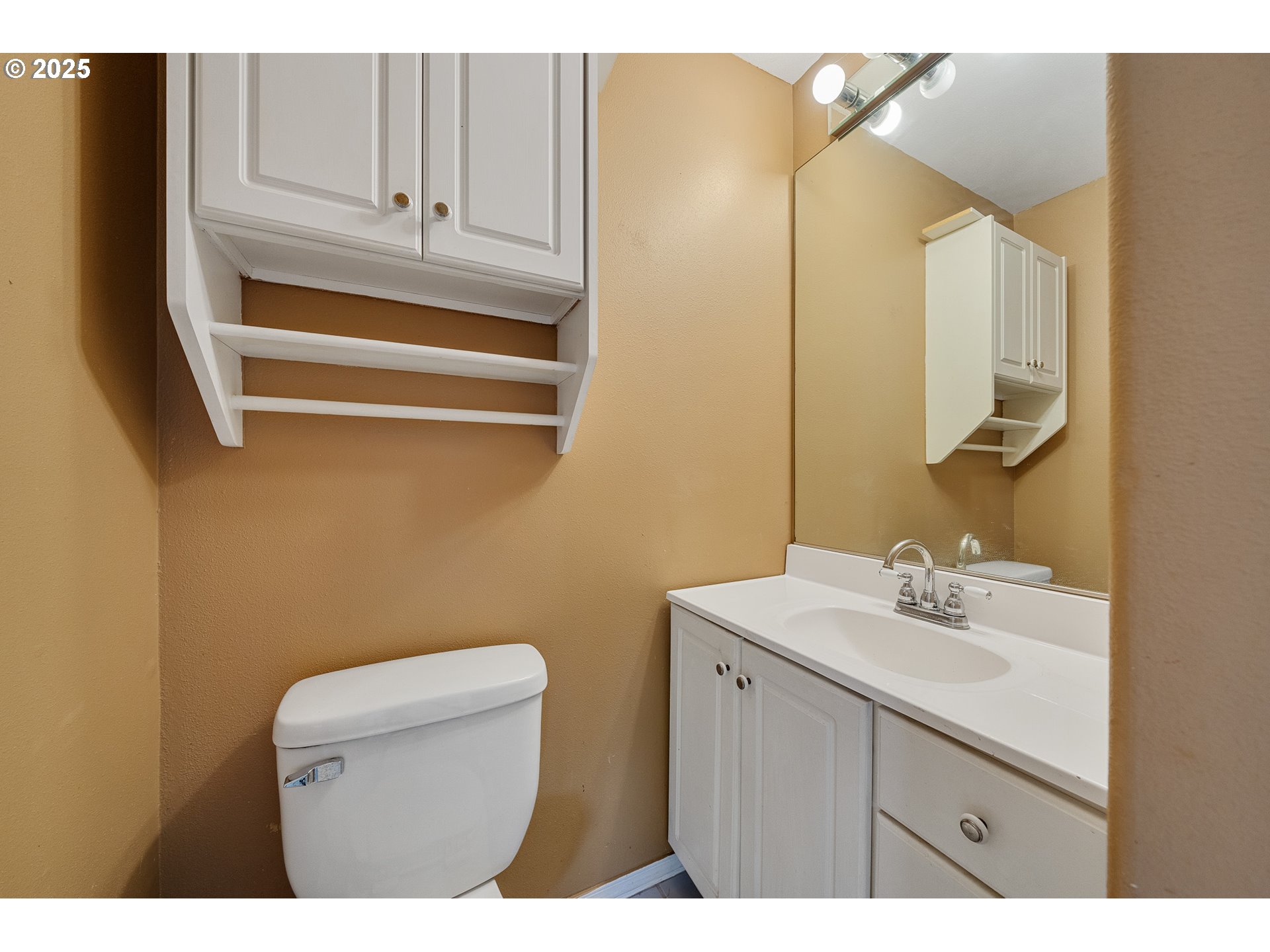 4805 Leonard Street West Netarts, OR 97141 - Photo 20 of 34 a bathroom with a sink a toilet and a mirror