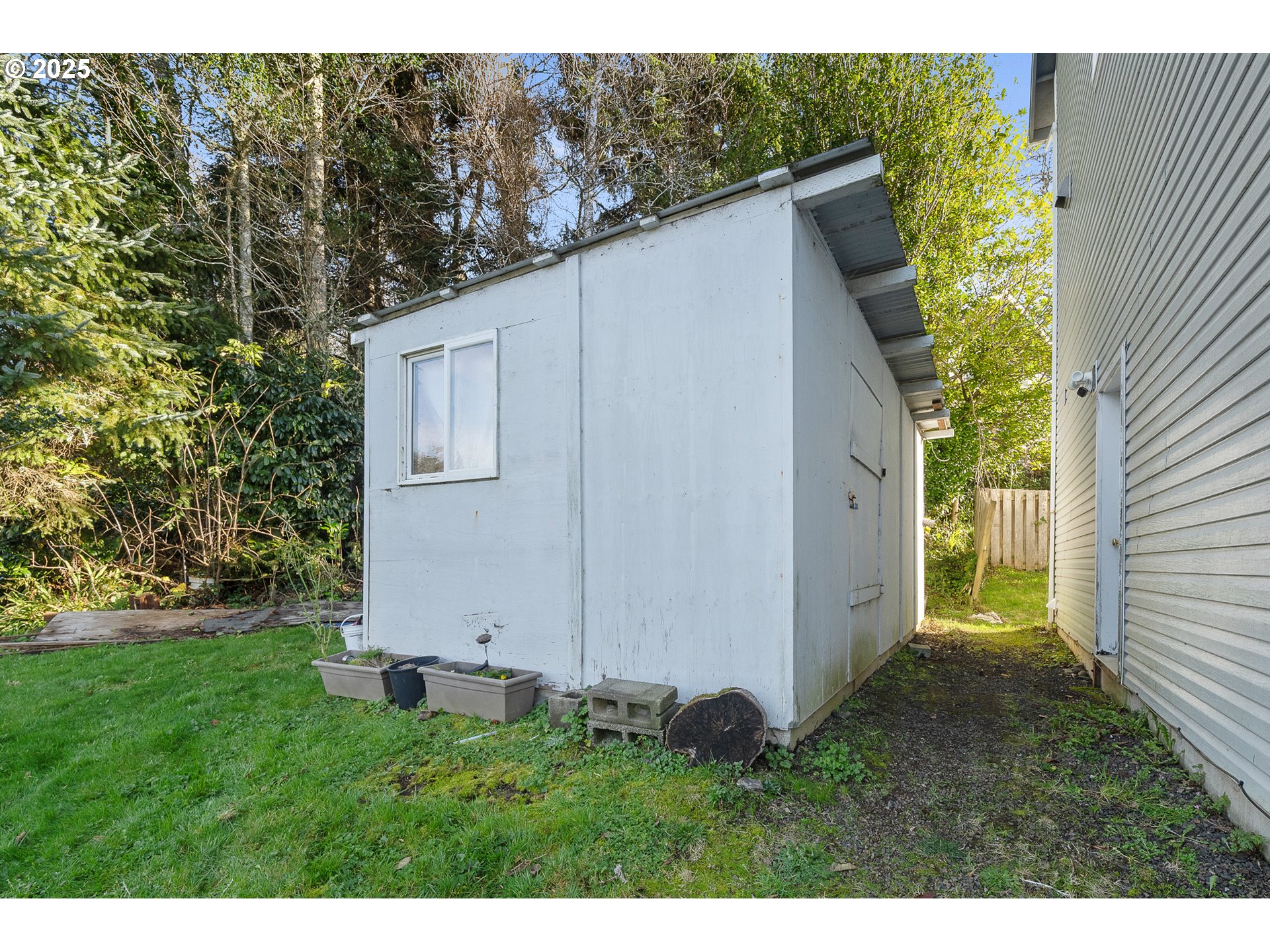 4805 Leonard Street West Netarts, OR 97141 - Photo 27 of 34 a view of a back yard of the house