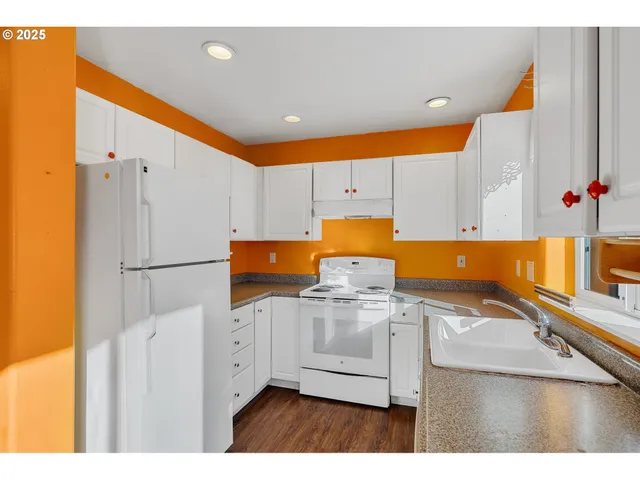 a bathroom with a sink mirror toilet and bathtub