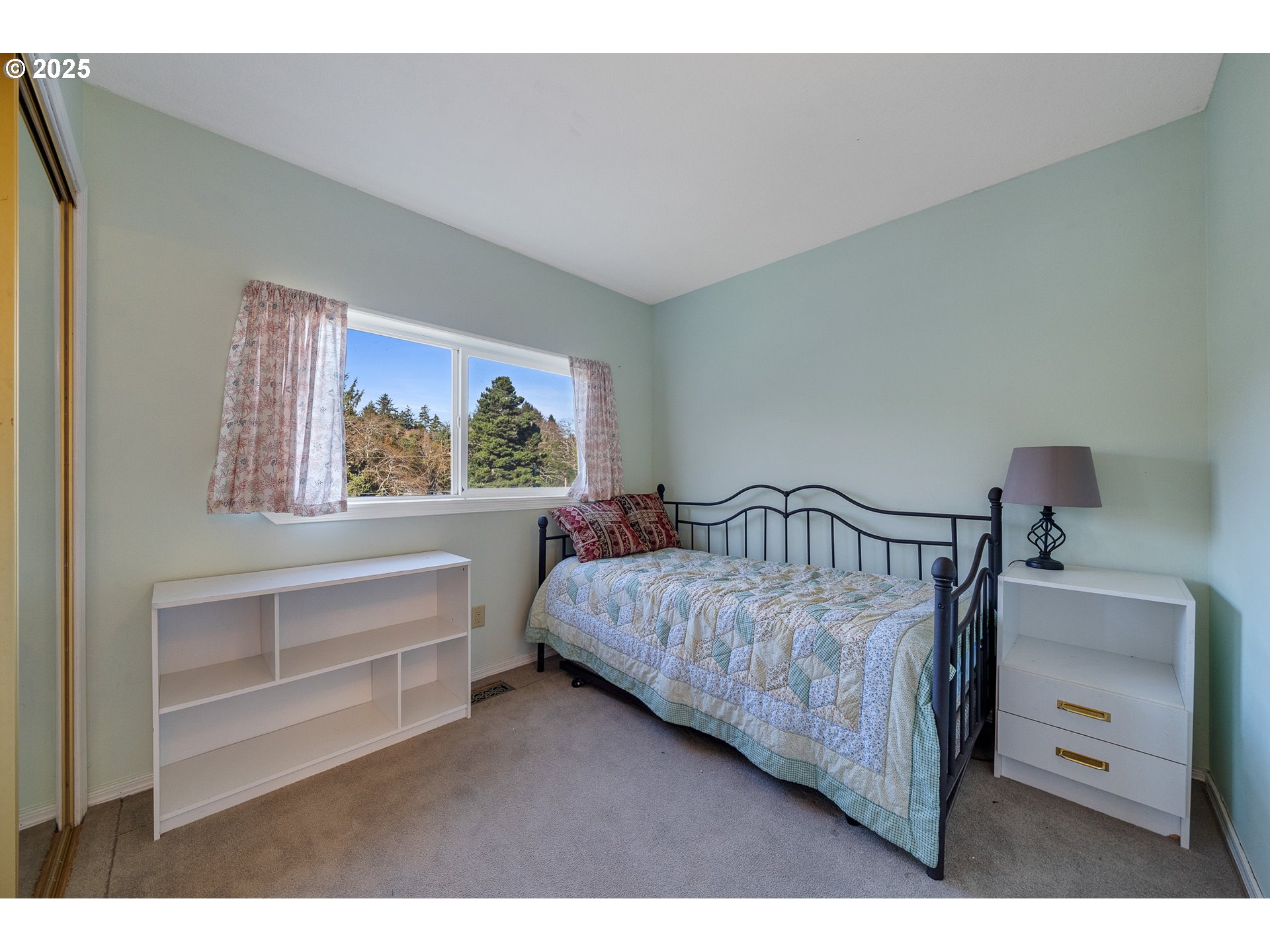 4805 Leonard Street West Netarts, OR 97141 - Photo 6 of 34 a bedroom with a bed and a window