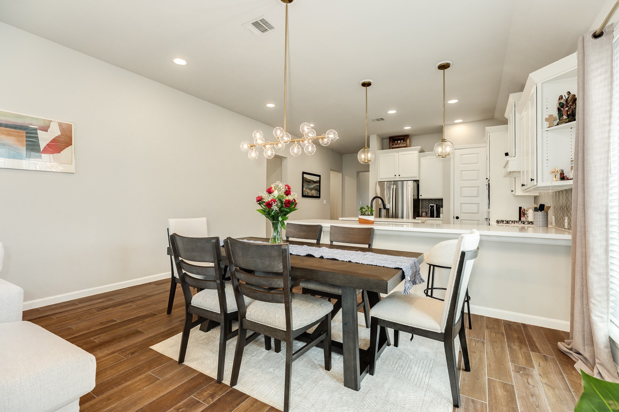 5039 Country Mdws Trail Iowa Colony, TX 77583 - Photo 12 of 50 a dining room with a table or chairs and a wooden floor