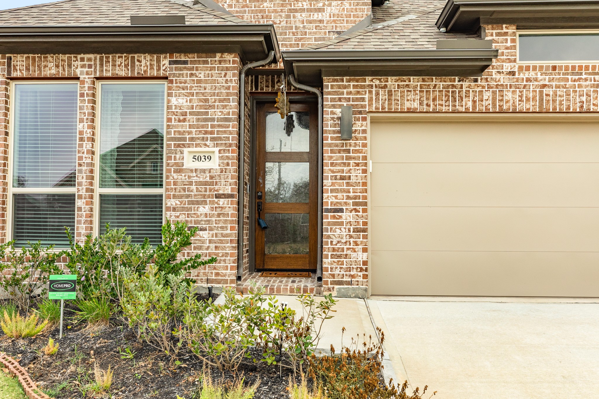 5039 Country Mdws Trail Iowa Colony, TX 77583 - Photo 2 of 50 a front view of a house with a yard