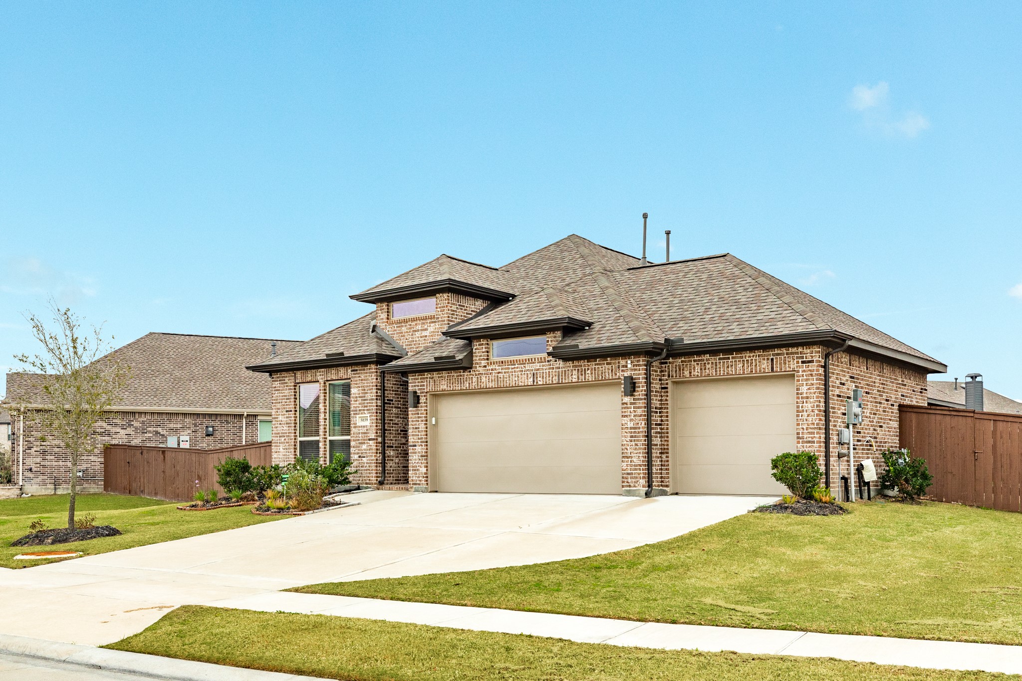 5039 Country Mdws Trail Iowa Colony, TX 77583 - Photo 35 of 50 a front view of a house with a yard and garage