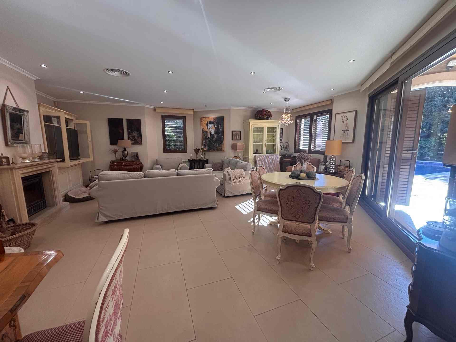 8 Carrer Del Teuladí Charlottesville, VC 46117 - Photo 22 of 30 a living room with fireplace furniture and a flat screen tv