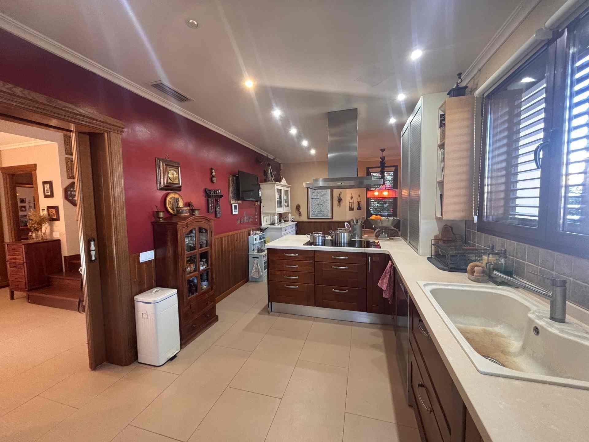 8 Carrer Del Teuladí Charlottesville, VC 46117 - Photo 3 of 30 a kitchen with stainless steel appliances granite countertop a sink and cabinets