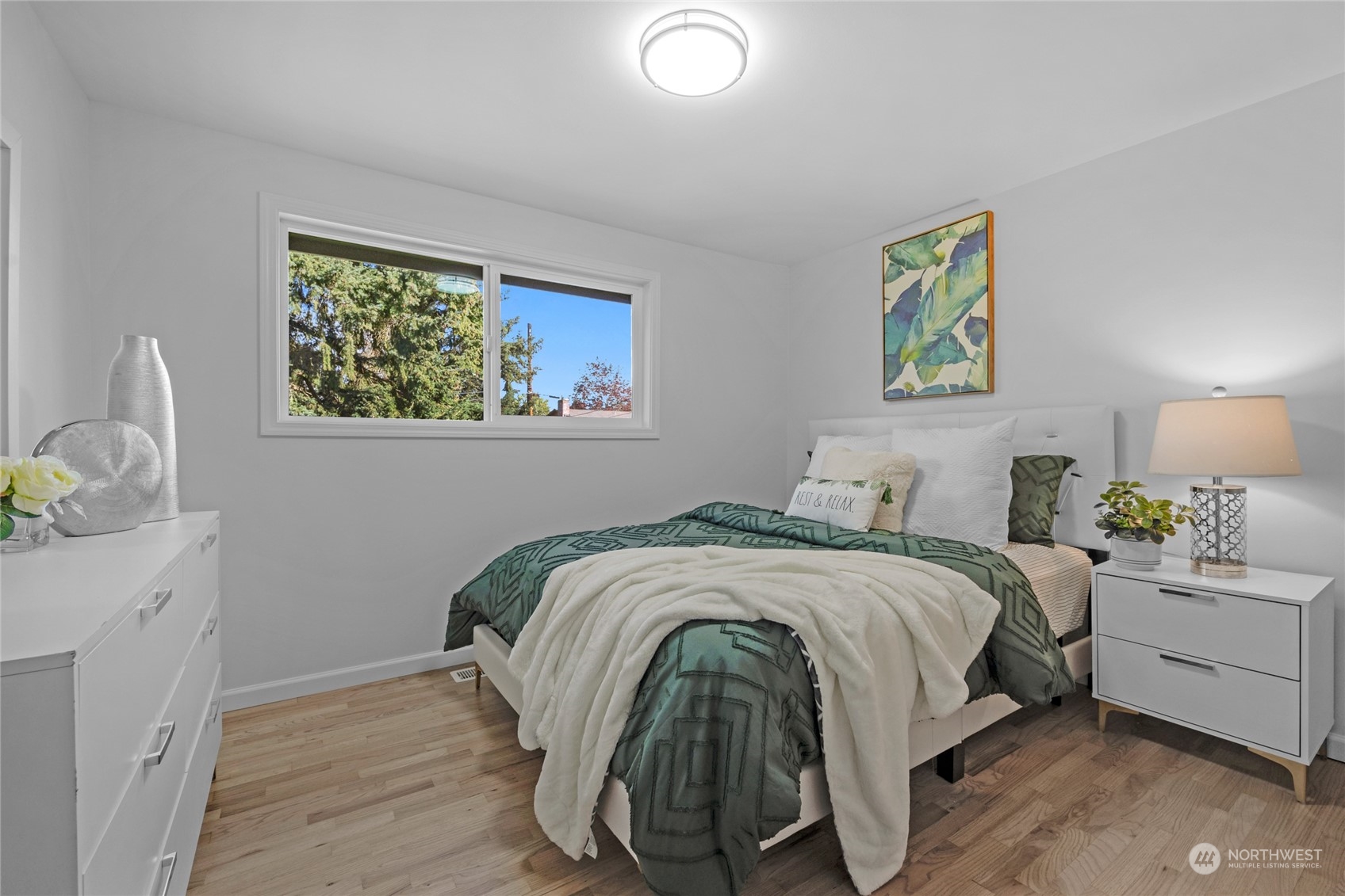 22608 23rd Place West Brier, WA 98036 - Photo 13 of 27 a bedroom with a bed and painting on the wall
