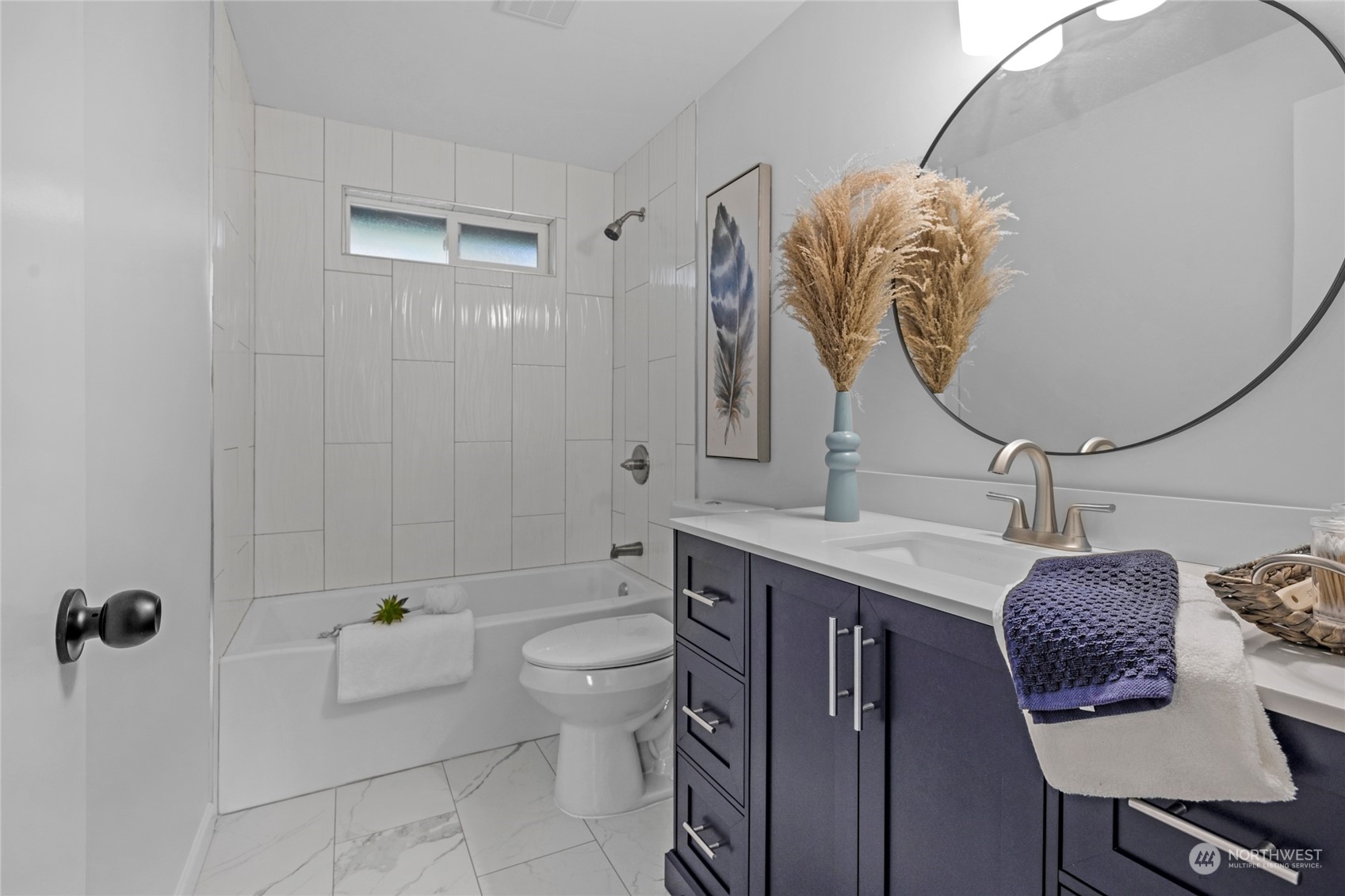 22608 23rd Place West Brier, WA 98036 - Photo 14 of 27 a bathroom with a granite countertop sink a toilet and a mirror