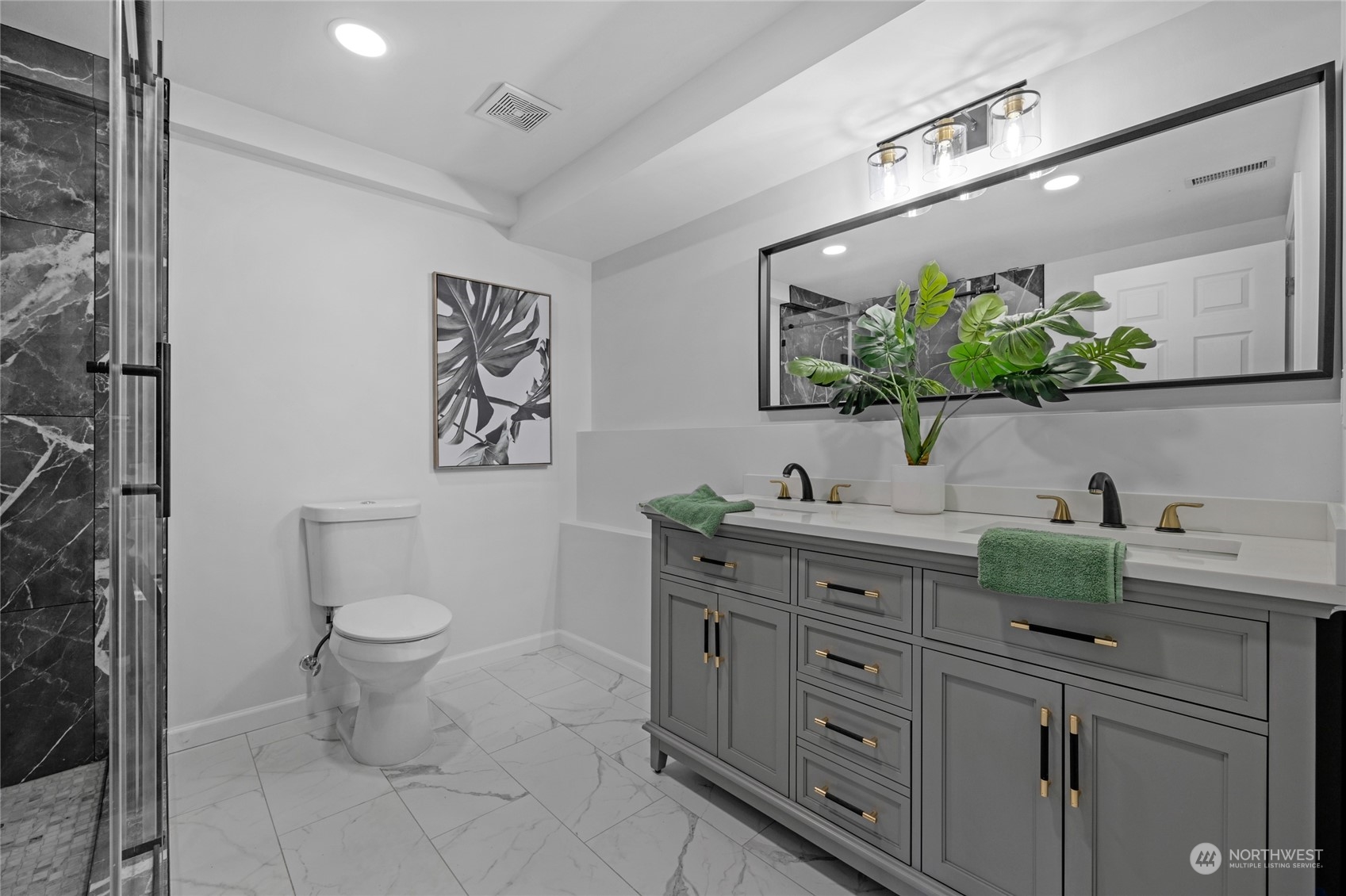 22608 23rd Place West Brier, WA 98036 - Photo 20 of 27 a bathroom with a granite countertop toilet sink and mirror