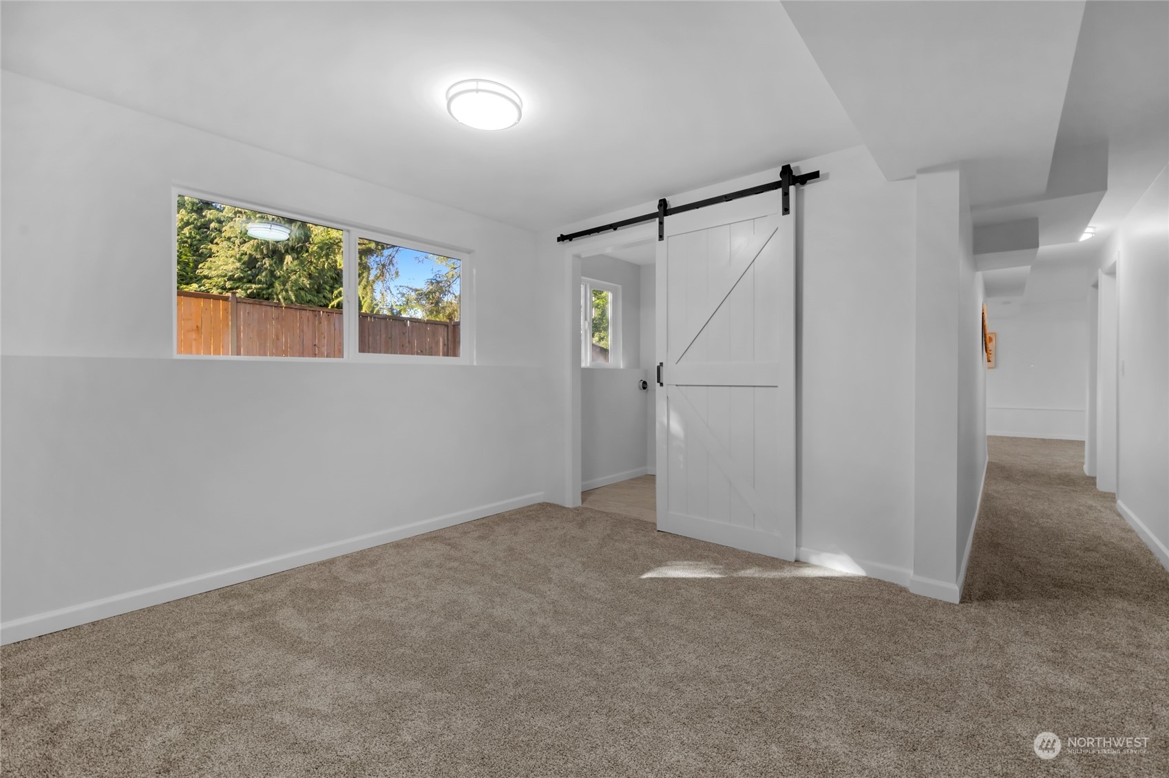 22608 23rd Place West Brier, WA 98036 - Photo 22 of 27 an empty room with white walls and windows