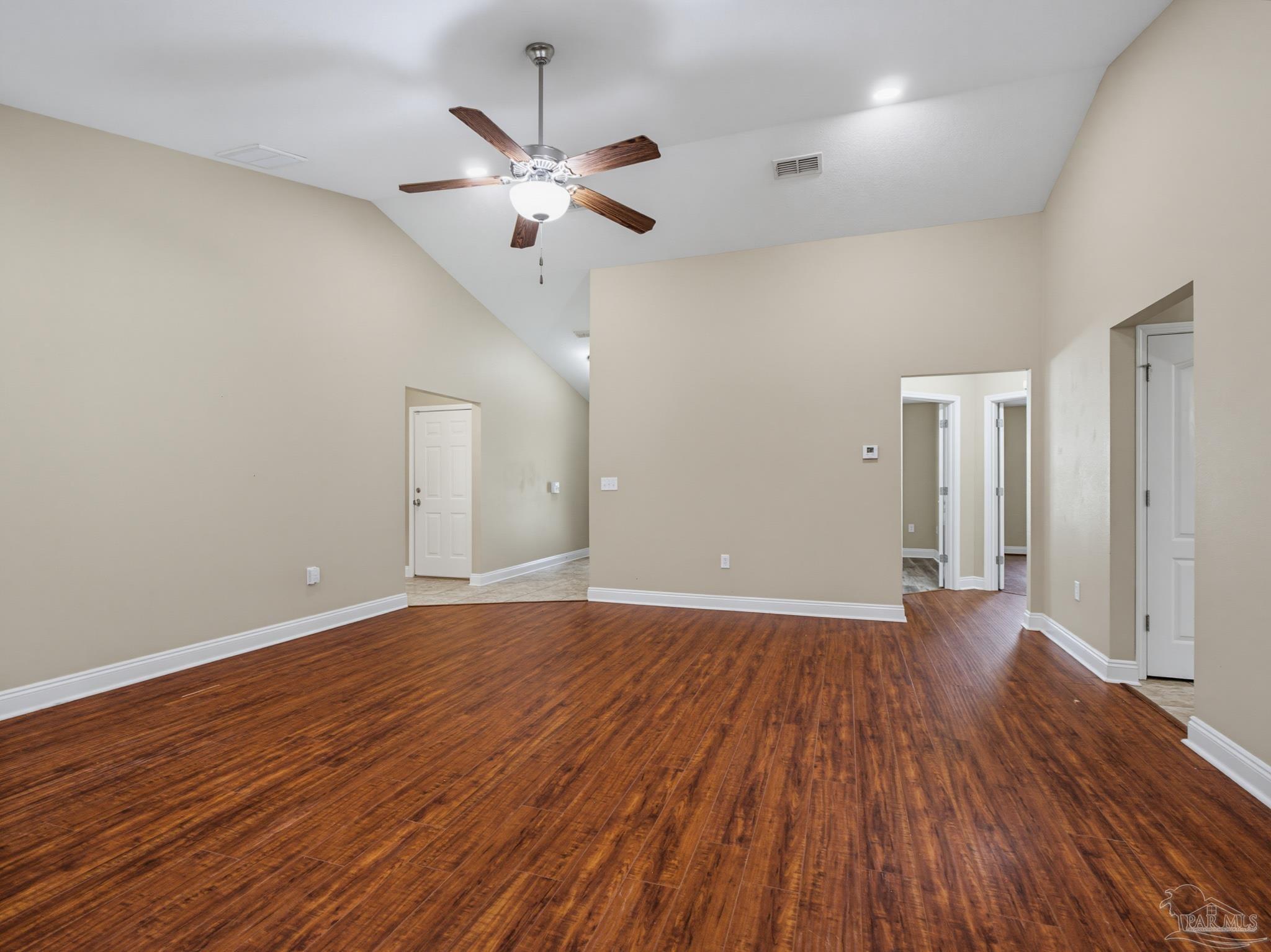 5567 Jones Street Milton, FL 32570 - Photo 8 of 48 a view of an empty room with wooden floor