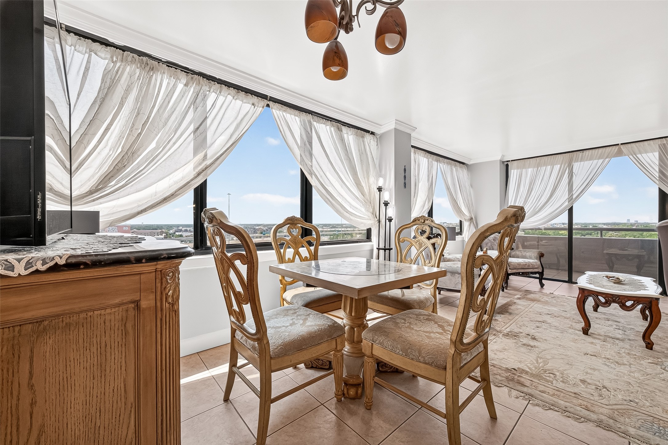3525 Sage Road, Unit 1116 Houston, TX 77056 - Photo 10 of 25 Sunlit dining area with sweeping views from large corner windows.