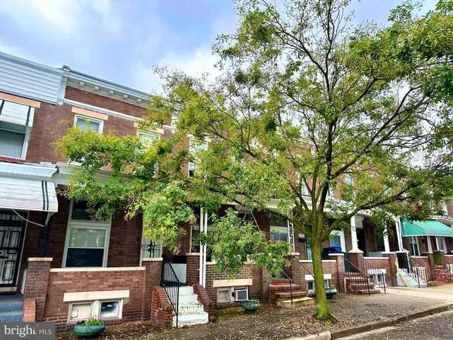 a view of a patio with table and chairs and potted plants