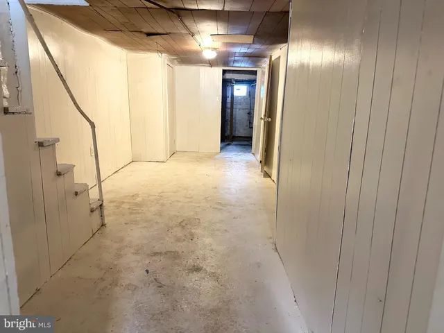 a view of a room with window and refrigerator
