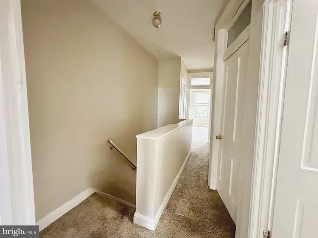 a view of a hallway with an entryway