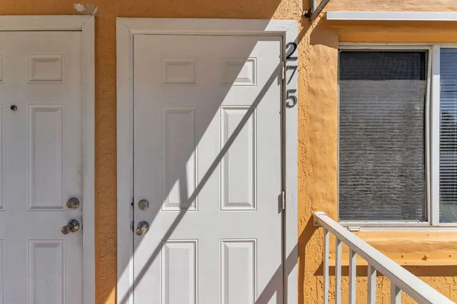 a work room with furniture and a potted plant