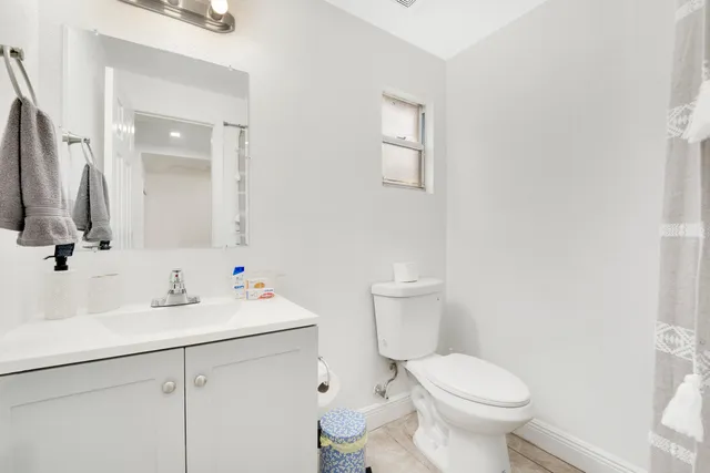 a kitchen with a cabinets and a refrigerator