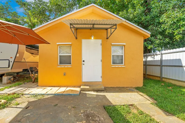 a backyard of a house with seating space