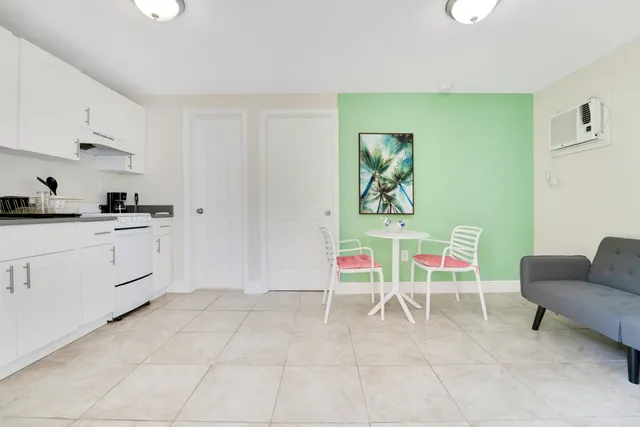 a kitchen with a cabinets and chair